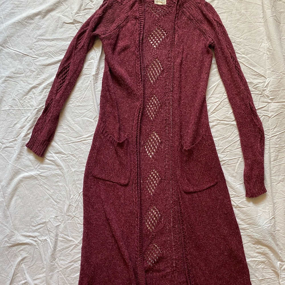 Long open knit cardigan.